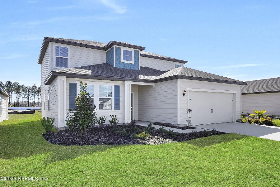 Front exterior of a new home in Westport Landing, Jacksonville, FL, highlighting curb appeal (Image 1).