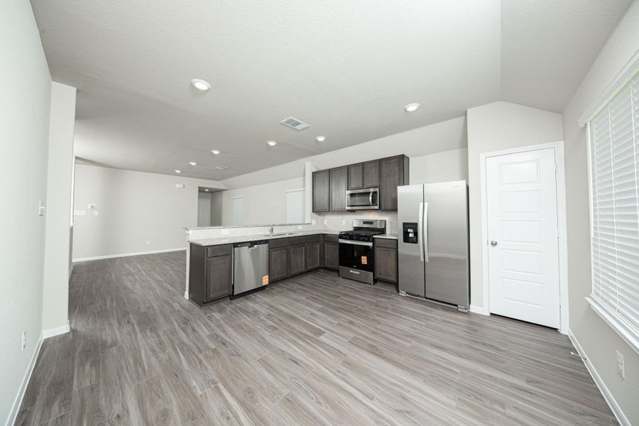 Furnished interior view inside a new home in Mackenzie Creek, Conroe (Image 6).