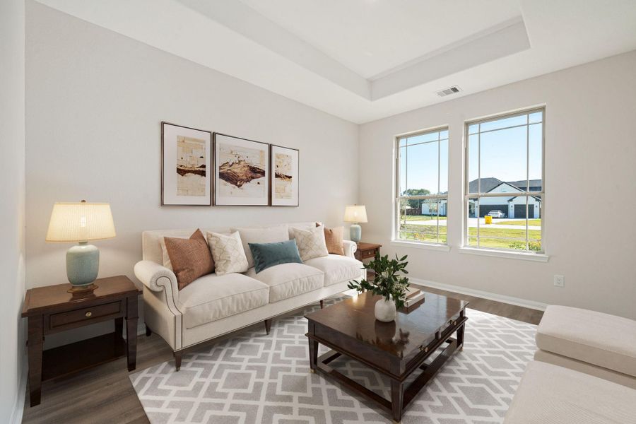 The bright and inviting living area at 11034 Moon Light Drive features an open-concept design that flows seamlessly into the kitchen and dining spaces. Neutral tones, recessed lighting, and wide-plank flooring create a modern yet comfortable atmosphere, while large windows fill the space with natural light, making it the perfect setting for both relaxing and entertaining The bright and inviting living area at 11034 Moon Light Drive features an open-concept design that flows seamlessly into the kitchen and dining spaces. Neutral tones, recessed lighting, and wide-plank flooring create a modern yet comfortable atmosphere, while large windows fill the space with natural light, making it the perfect setting for both relaxing and entertaining