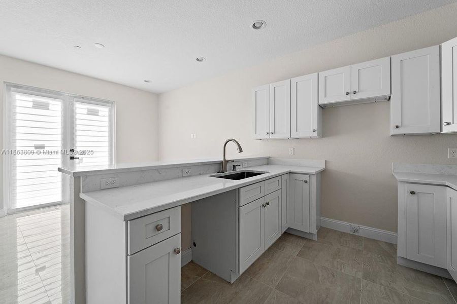 Furnished interior view inside a new home in , Tamarac (Image 9).