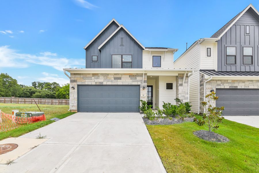 Front exterior of a new home in Summer Place  35', Montgomery, TX, highlighting curb appeal (Image 28).