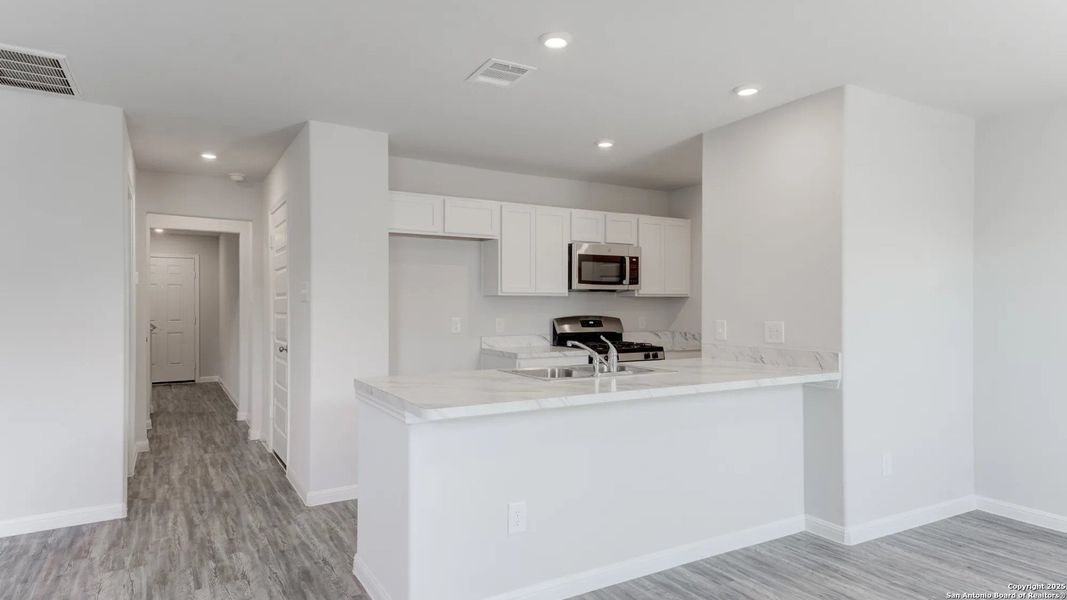 Furnished interior view inside a new home in Las Colinas, Kenedy (Image 3). Furnished interior view inside a new home in Las Colinas, Kenedy (Image 3).