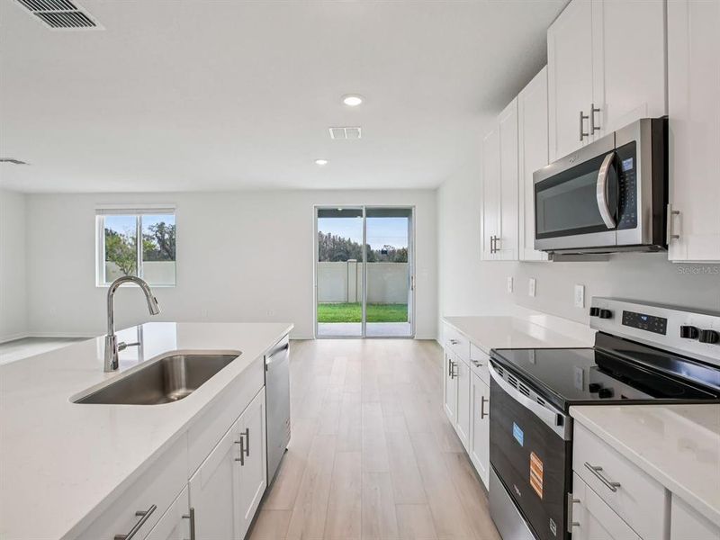 Furnished interior view inside a new home in Oakfield Trails - Classic Series, Parrish (Image 6).