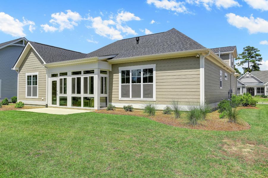 Representative exterior photo of a completed home built from the Claremont by Bill Clark Homes in The Sanctuary at Sunset Beach, Sunset Beach, NC (Image 32). Representative exterior photo of a completed home built from the Claremont by Bill Clark Homes in The Sanctuary at Sunset Beach, Sunset Beach, NC (Image 32).