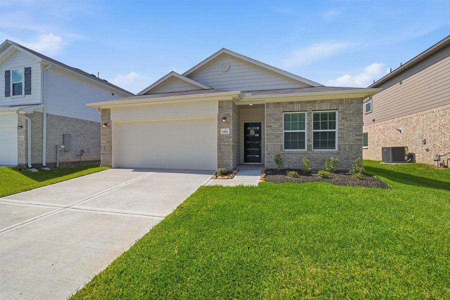 Front exterior of a new home in Steed Landing, Texas City, TX, highlighting curb appeal (Image 1). Front exterior of a new home in Steed Landing, Texas City, TX, highlighting curb appeal (Image 1).