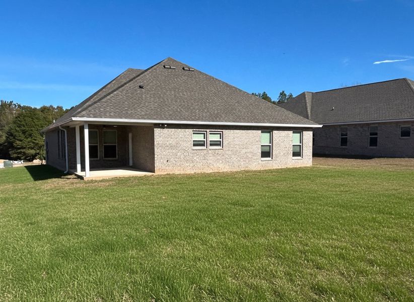 Front exterior of a new home in Young Oaks, Crestview, FL, highlighting curb appeal (Image 16). Front exterior of a new home in Young Oaks, Crestview, FL, highlighting curb appeal (Image 16).
