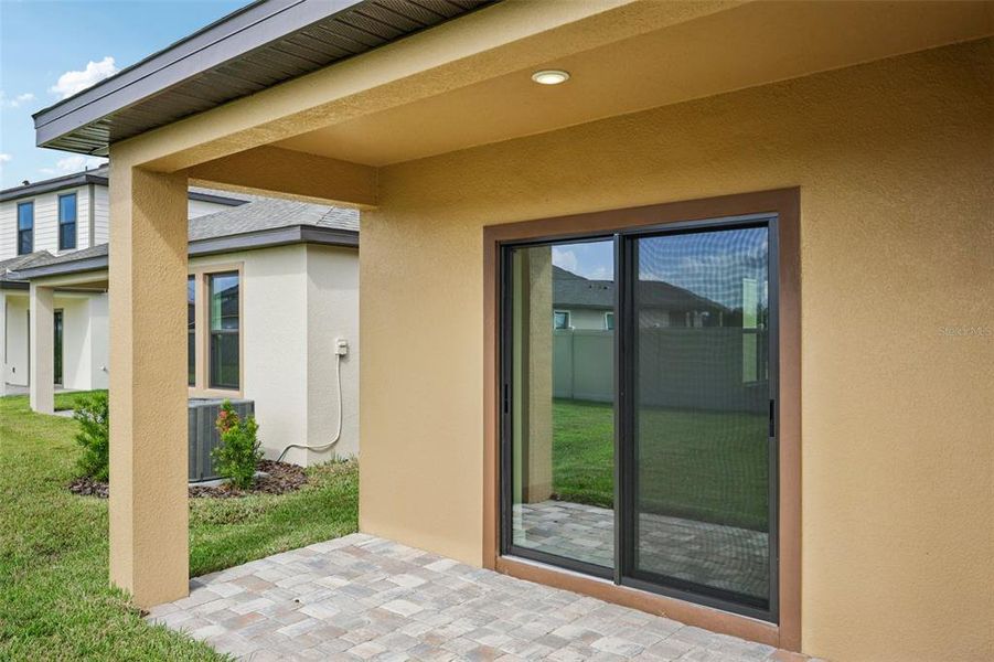 Exterior details and patio area of a home in Grasslands West, Lakeland (Image 3).