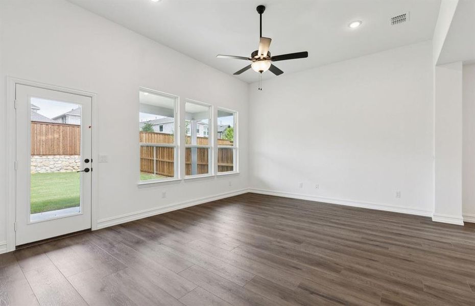 Expansive gathering room bathed in natural sunlight   *Real home pictured