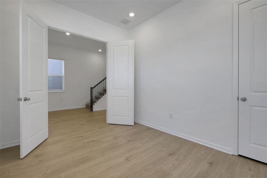 Spacious, unfurnished interior of a new home in Serenade at Ovation, Winter Garden (Image 26).