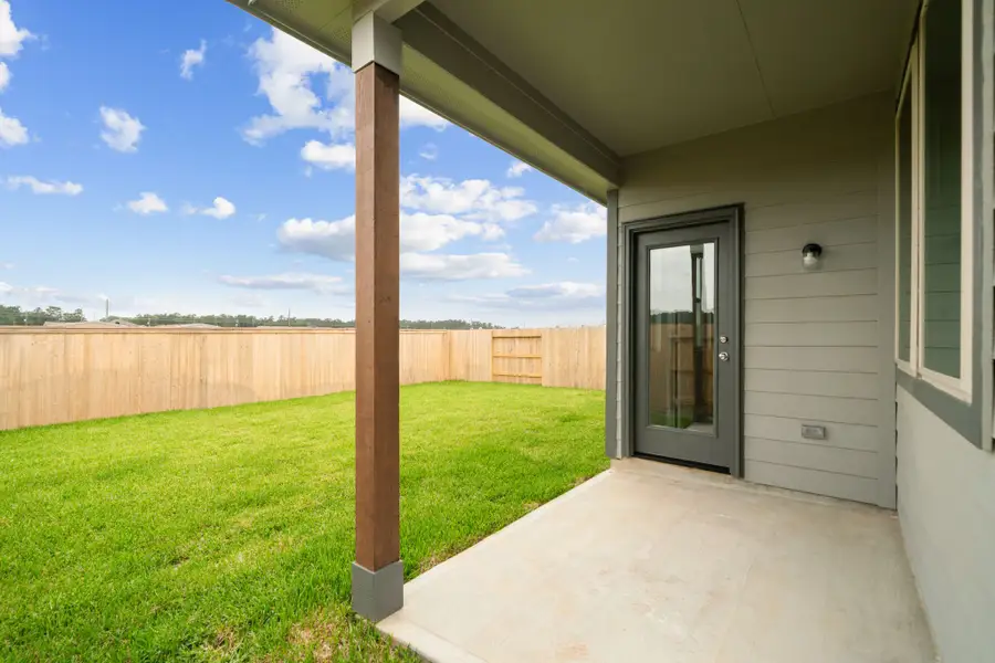 Covered Patio on the Cedar home plan by Trophy Signature Homes – REPRESENTATIVE PHOTO Covered Patio on the Cedar home plan by Trophy Signature Homes – REPRESENTATIVE PHOTO