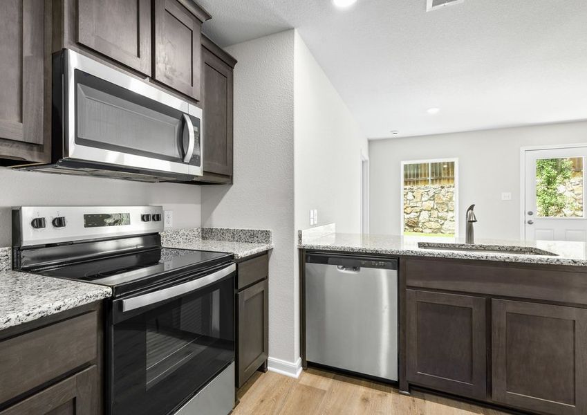 The kitchen has sprawling granite countertops. The kitchen has sprawling granite countertops.