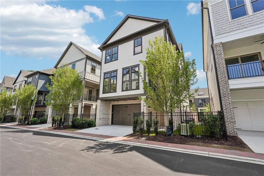 Front exterior of a new home in Park Walke, Alpharetta, GA, highlighting curb appeal (Image 29).