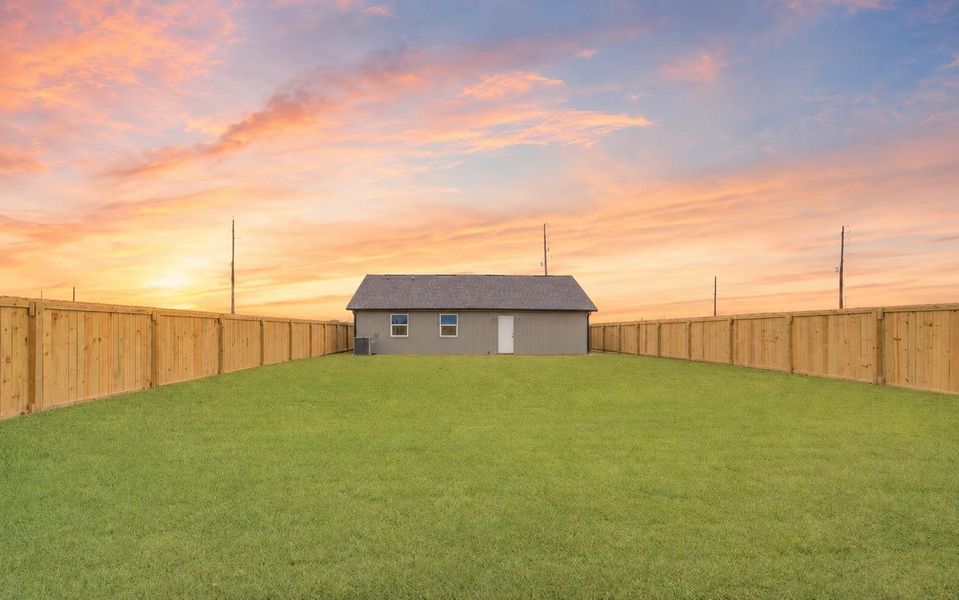 Turn this spacious backyard into something uniquely yours. (Sky Virtually Enhanced)