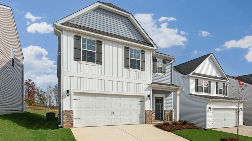 Front exterior of a new home in The Grove at Matthews Landing, Fuquay Varina, NC, highlighting curb appeal (Image 2). Front exterior of a new home in The Grove at Matthews Landing, Fuquay Varina, NC, highlighting curb appeal (Image 2).