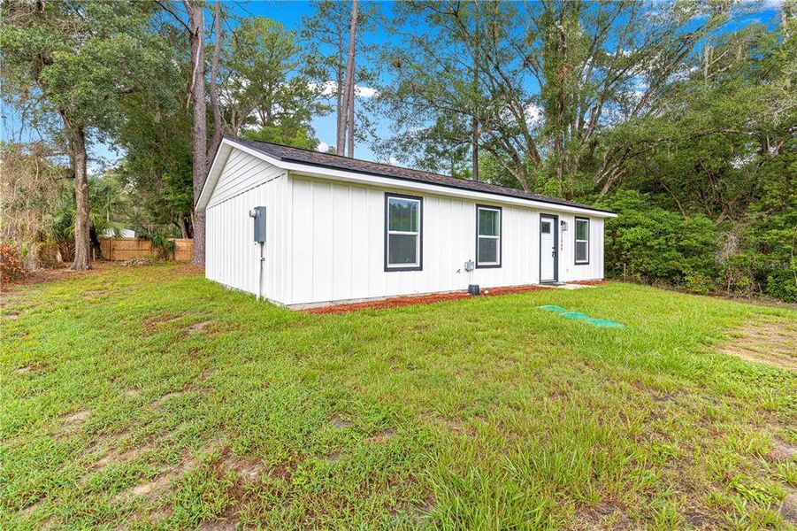 Exterior details and patio area of a home in , Fort McCoy (Image 12).