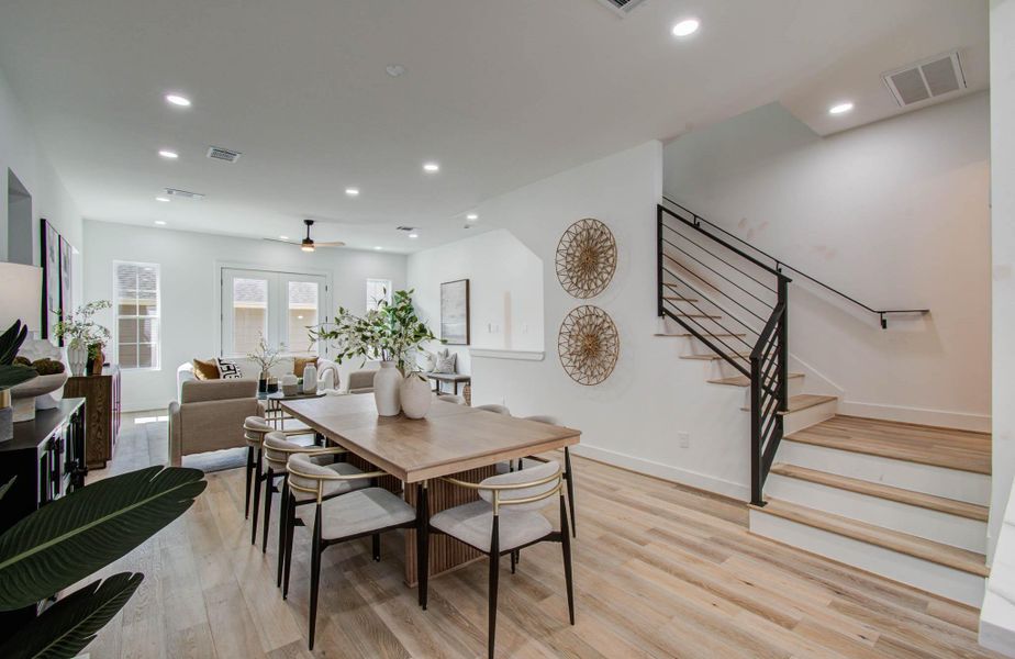 View of landing and stairs to the third floor. Powder bath on the landing.