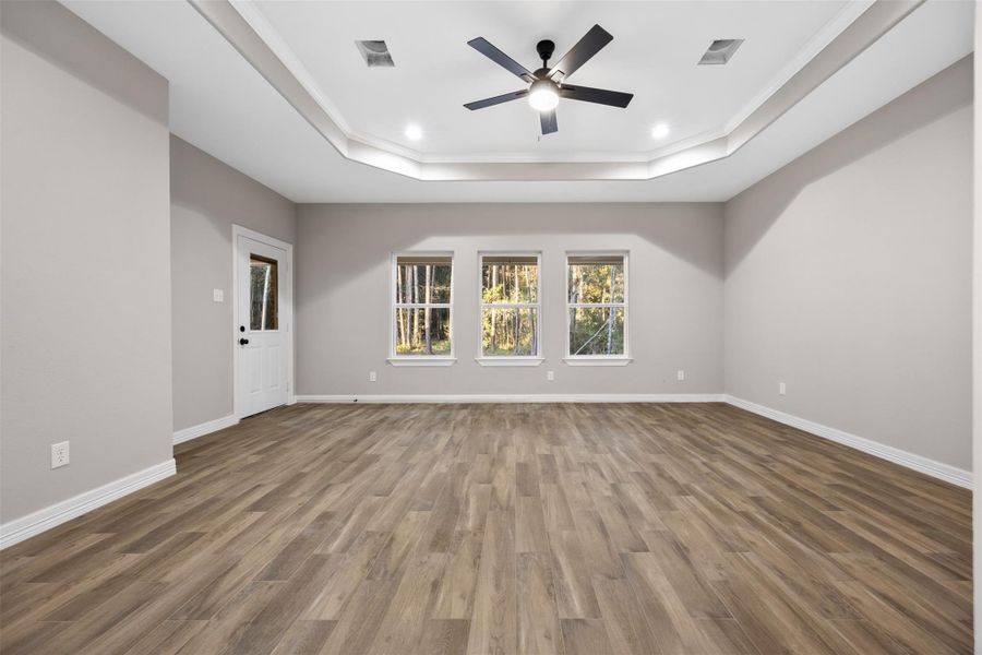 Primary bedroom with back door exit to patio Primary bedroom with back door exit to patio