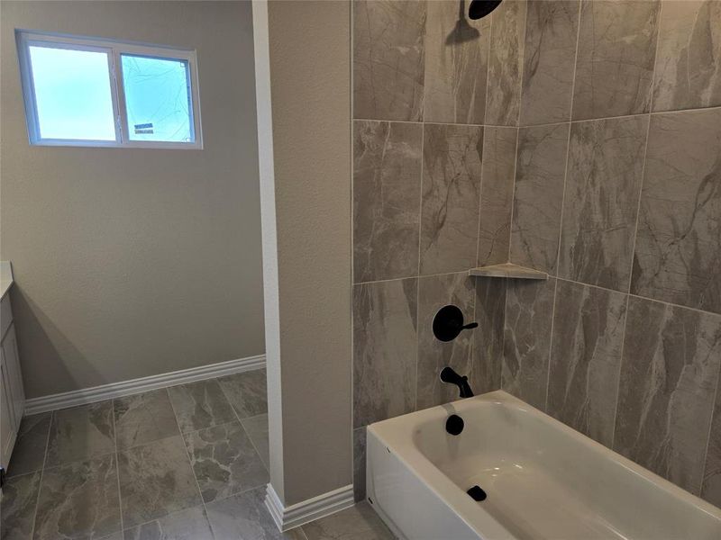 Full bath with shower / bathtub combination and vanity Full bath with shower / bathtub combination and vanity