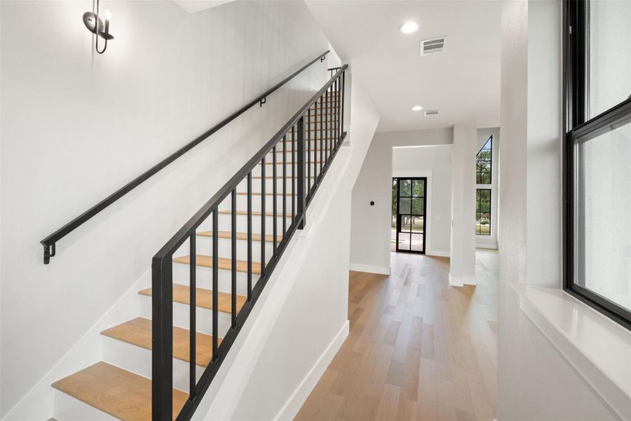 Clean lines and a modern aesthetic define this inviting entryway and staircase. Clean lines and a modern aesthetic define this inviting entryway and staircase.