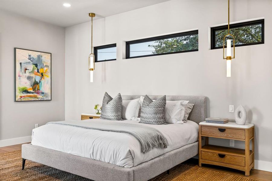 Bedroom with wood finished floors and recessed lighting Bedroom with wood finished floors and recessed lighting