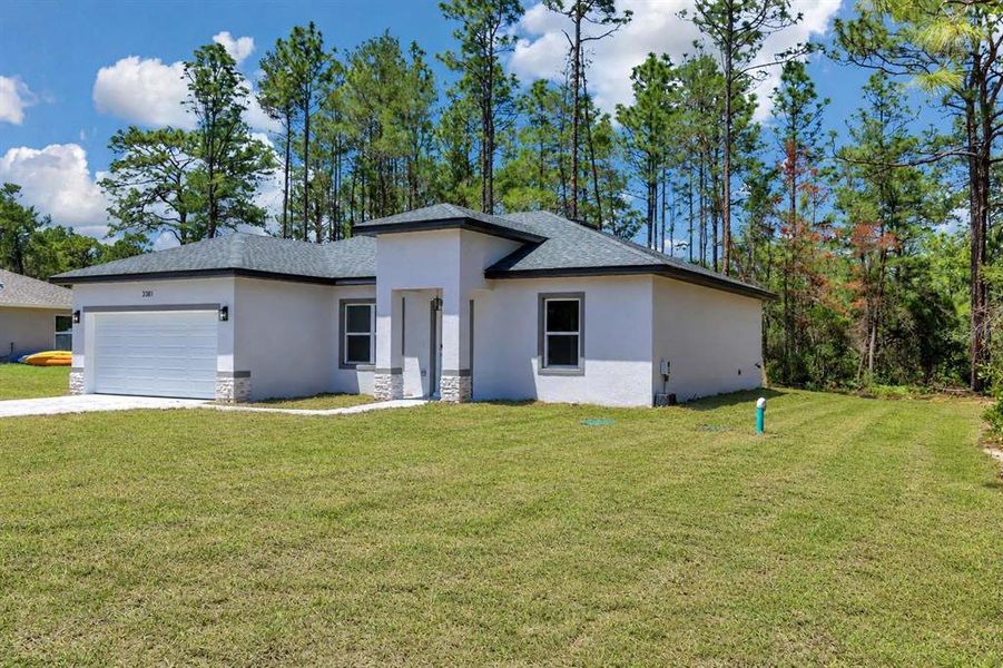 Front exterior of a new home in , Citrus Springs, FL, highlighting curb appeal (Image 21). Front exterior of a new home in , Citrus Springs, FL, highlighting curb appeal (Image 21).