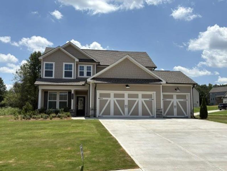 Front exterior of a new home in Wellington Estates, Madison, GA, highlighting curb appeal (Image 1). Front exterior of a new home in Wellington Estates, Madison, GA, highlighting curb appeal (Image 1).