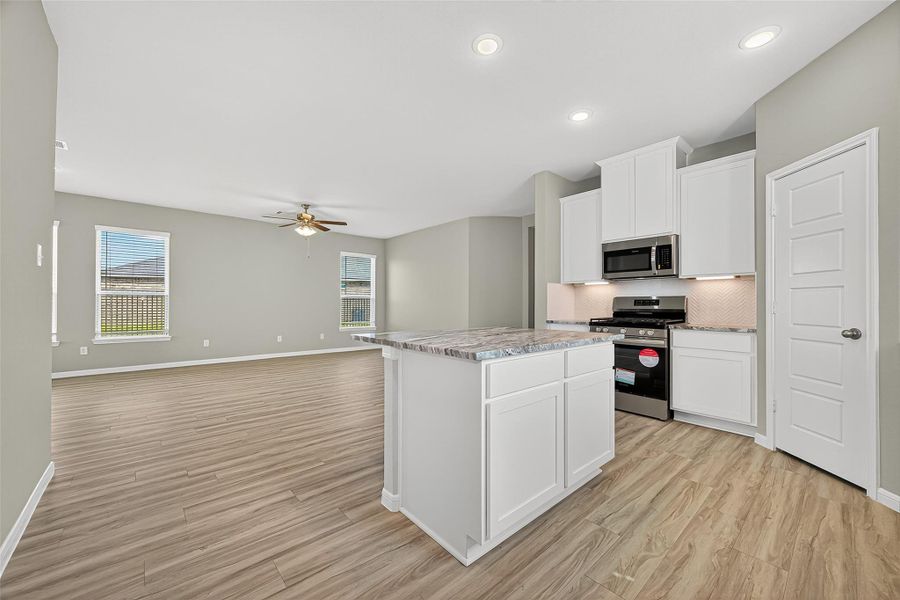 Furnished interior view inside a new home in Sunterra, Katy (Image 6).