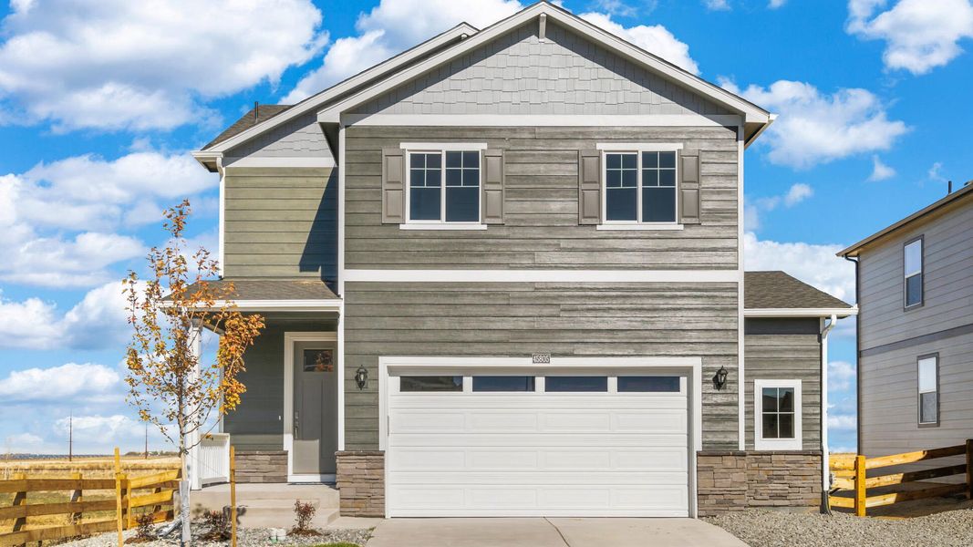 Front exterior of a new home in The Ridge at Lorson Ranch, Colorado Springs, CO, highlighting curb appeal (Image 1).
