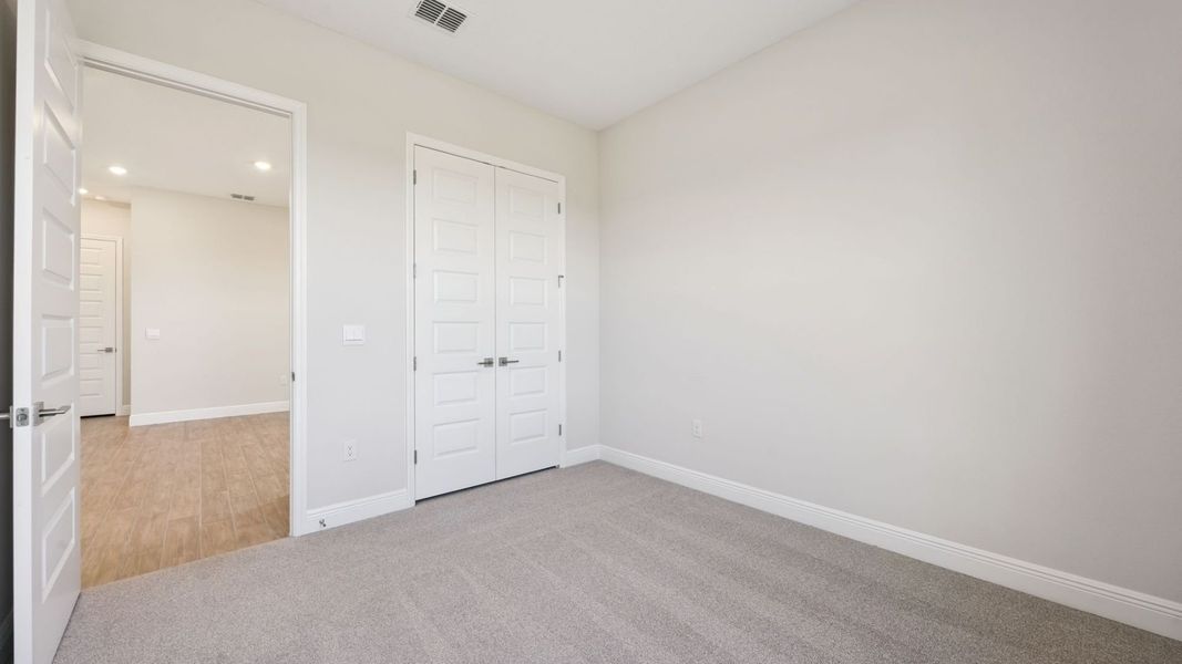 Representative unfurnished interior of a home built from the Everett by D.R. Horton in Buena Lago, St. Cloud (Image 24).
