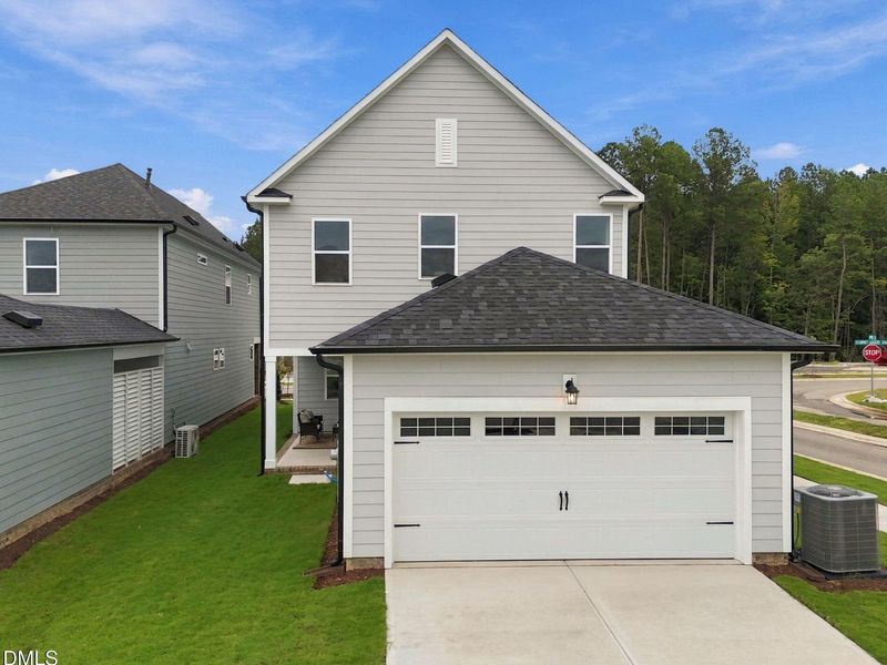 Front exterior of a new home in Forestville Yard, Knightdale, NC, highlighting curb appeal (Image 27). Front exterior of a new home in Forestville Yard, Knightdale, NC, highlighting curb appeal (Image 27).