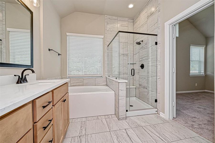 Separate shower and bathtub for main bedroom