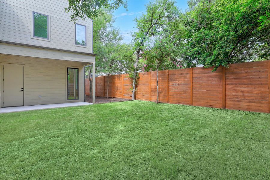 Fenced backyard featuring a patio area Fenced backyard featuring a patio area