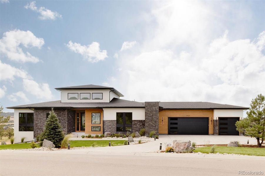 Front exterior of a new home in , Franktown, CO, highlighting curb appeal (Image 2).