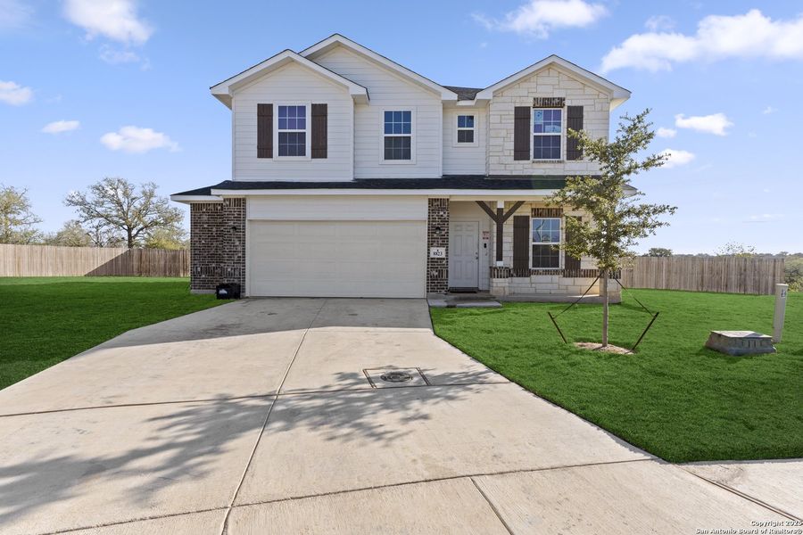 Front exterior of a new home in Hickory Ridge, Elmendorf, TX, highlighting curb appeal (Image 23).