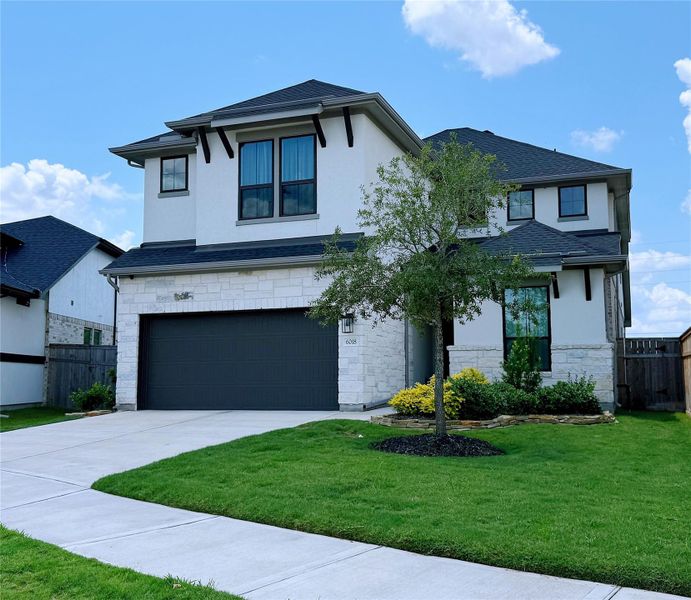 Front exterior of a new home in , Fulshear, TX, highlighting curb appeal (Image 23).