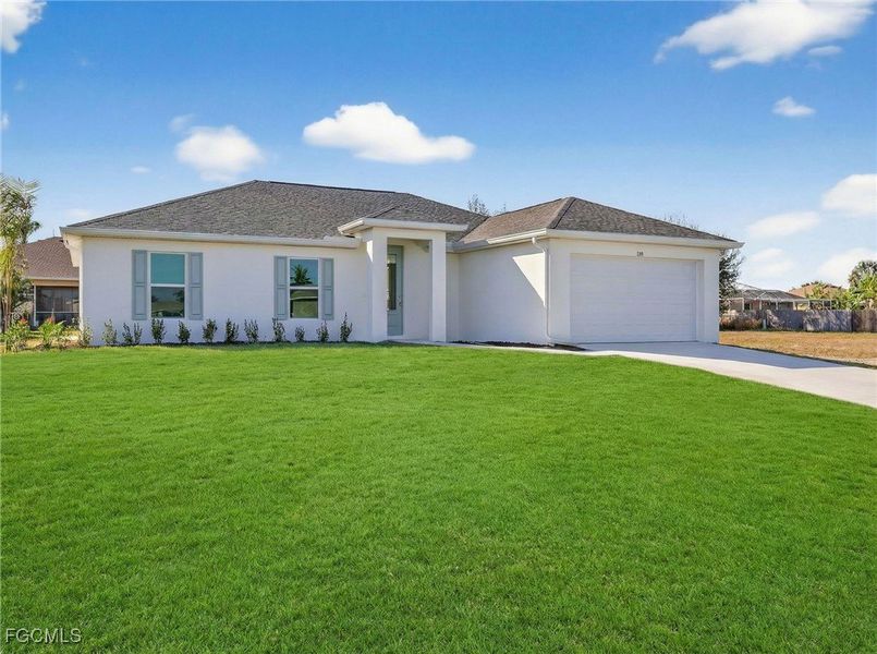 Front exterior of a new home in Cape Coral, Cape Coral, FL, highlighting curb appeal (Image 2). Front exterior of a new home in Cape Coral, Cape Coral, FL, highlighting curb appeal (Image 2).