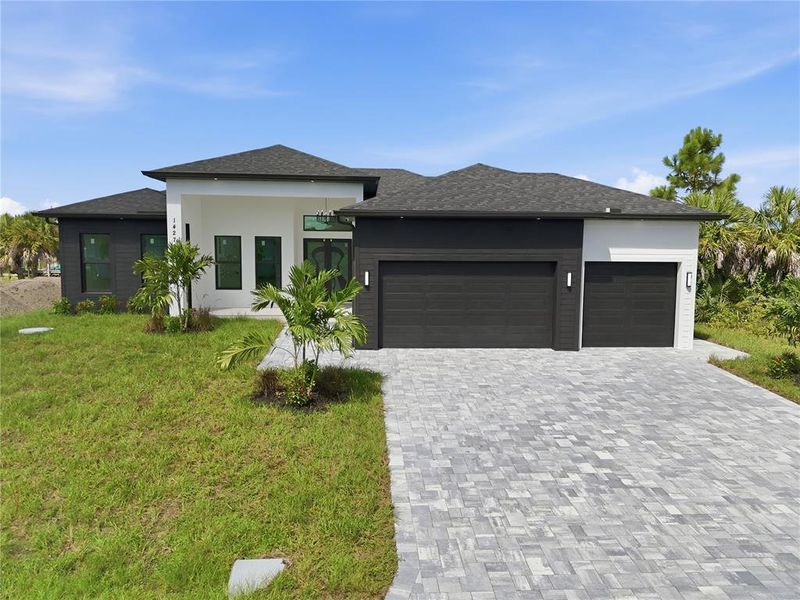 Front exterior of a new home in , Port Charlotte, FL, highlighting curb appeal (Image 2). Front exterior of a new home in , Port Charlotte, FL, highlighting curb appeal (Image 2).