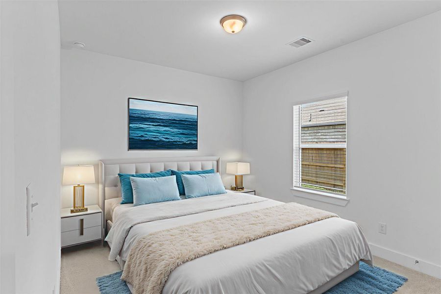 Another spacious bedroom that feels open and restful! Large windows bring in beautiful sunlight while neutral tones make decorating effortless — a wonderful room for family or visitors. *Photo is Virtually Staged*