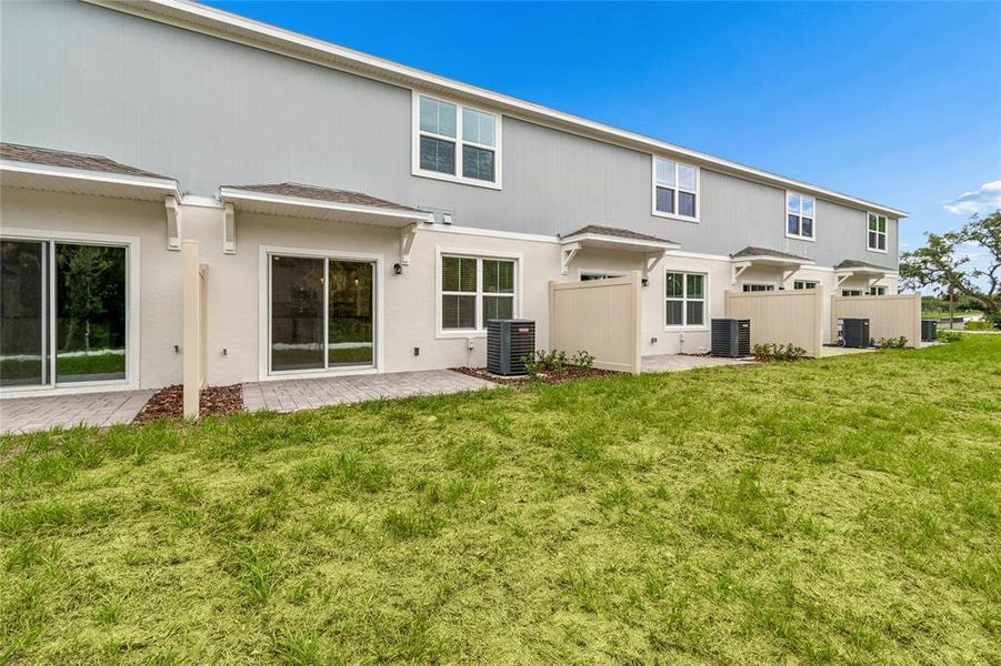 Exterior details and patio area of a home in Aspire at Canter Creek, Davenport (Image 3).