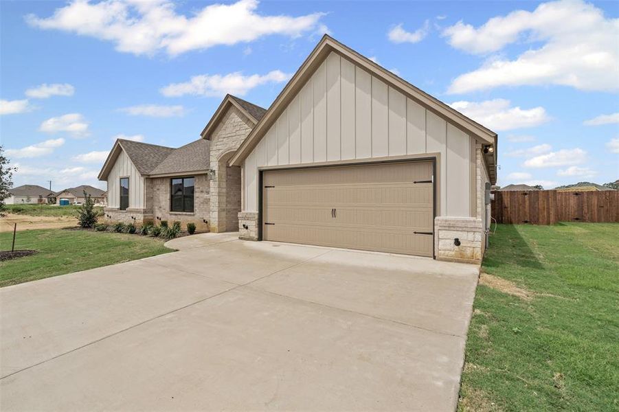 Front exterior of a new home in , Springtown, TX, highlighting curb appeal (Image 1). Front exterior of a new home in , Springtown, TX, highlighting curb appeal (Image 1).