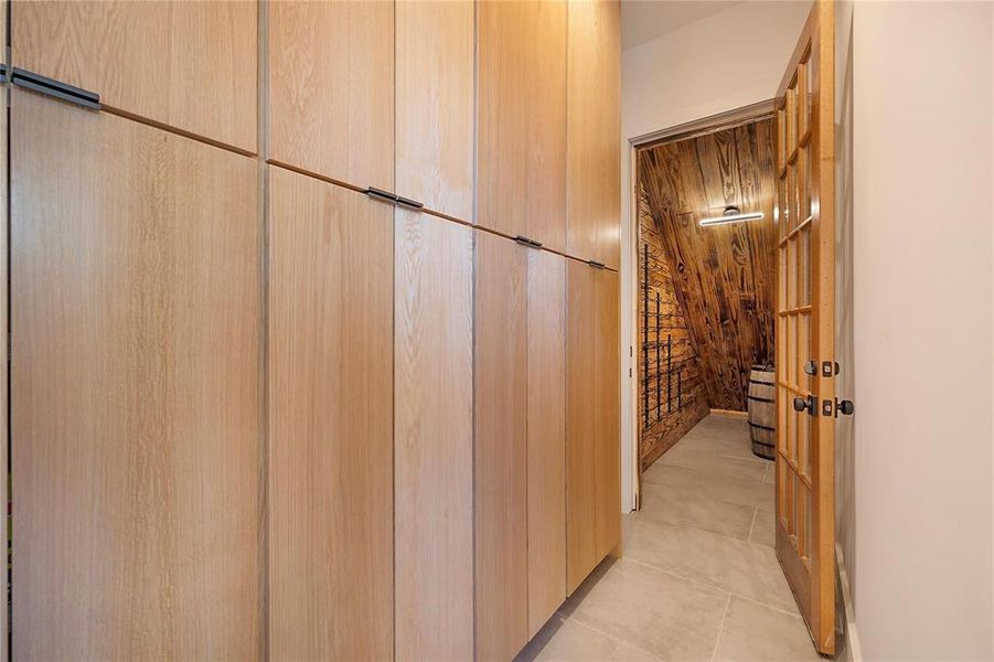 Corridor with light tile patterned floors