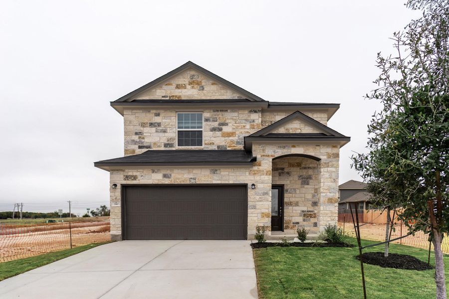 Front exterior of a new home in Cool Water, Jarrell, TX, highlighting curb appeal (Image 1). Front exterior of a new home in Cool Water, Jarrell, TX, highlighting curb appeal (Image 1).