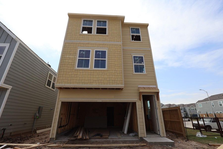 Three story home with 4 beds, 3.5 baths, and 2 car garage