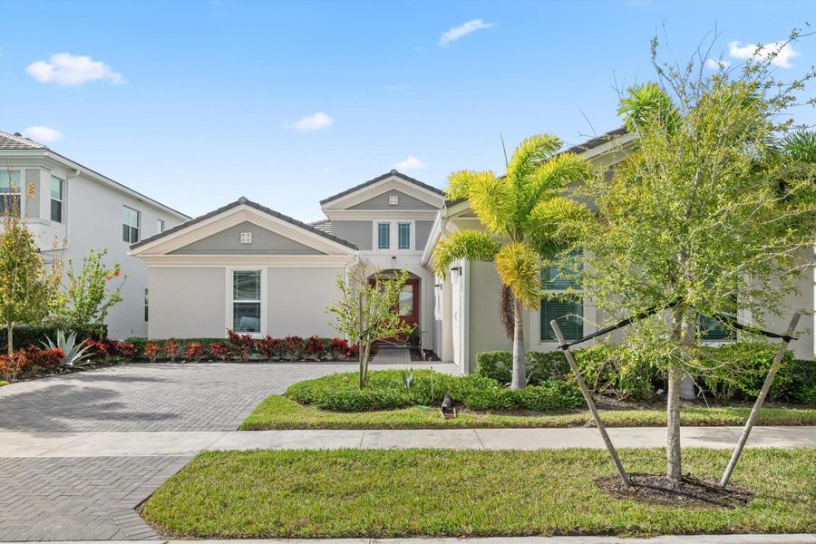 Front exterior of a new home in , The Acreage, FL, highlighting curb appeal (Image 2).