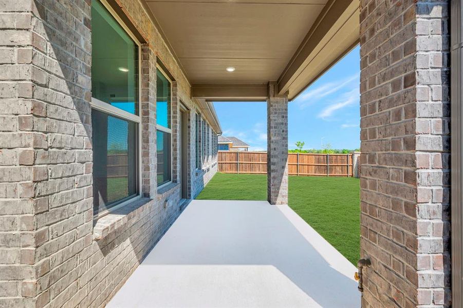 Exterior details and patio area of a home in Vintage Village, Argyle (Image 22).