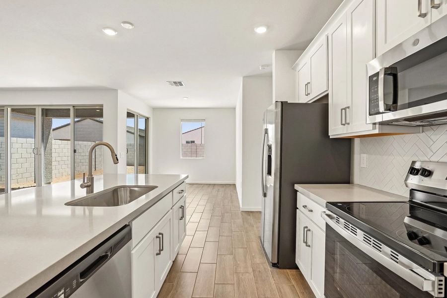 Kitchen and dining. Not actual home, options and finishes may vary.