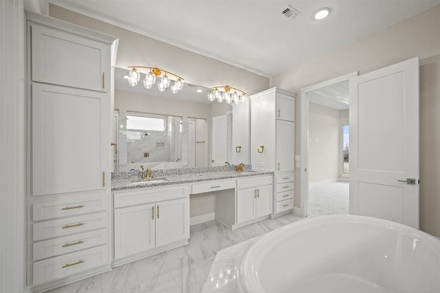 Highlighting an amazing free standing tub, this Primary Bathroom is stunning!