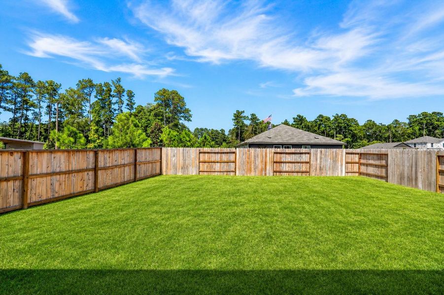 Enjoy the privacy and flexibility of this spacious fenced backyard, with plenty of room for pets, play, outdoor entertaining, or simply relaxing and enjoying the peaceful surroundings.Grass has been virtually enhanced