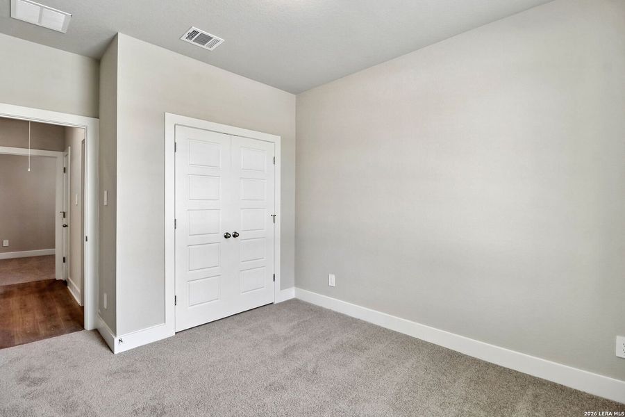 Spacious, unfurnished interior of a new home in Estancia Ranch - Premier Series, San Antonio (Image 21).