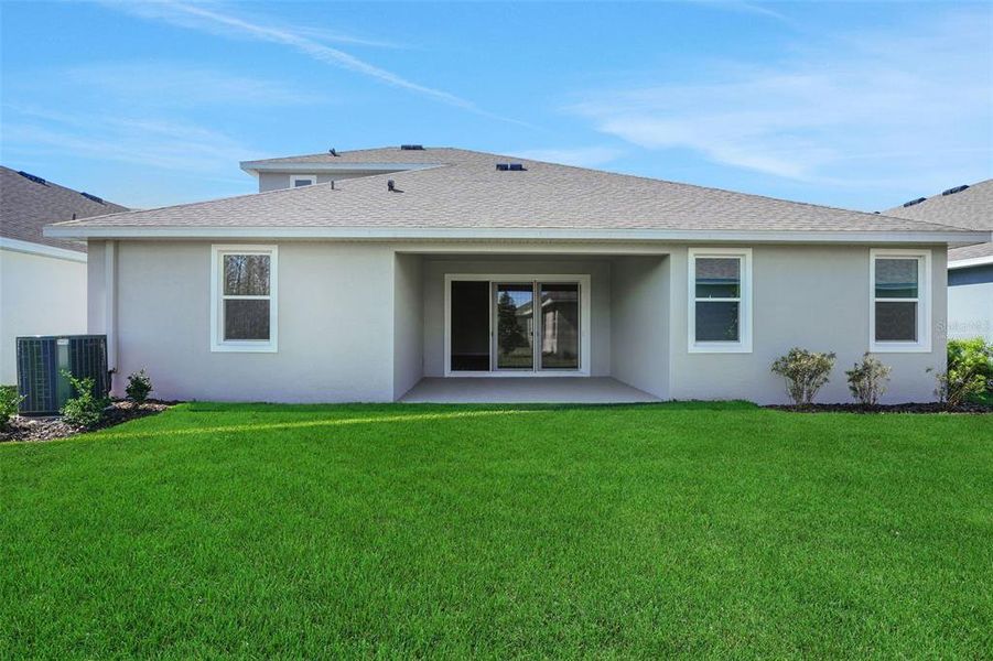 Exterior details and patio area of a home in Angeline, Land O' Lakes (Image 24).